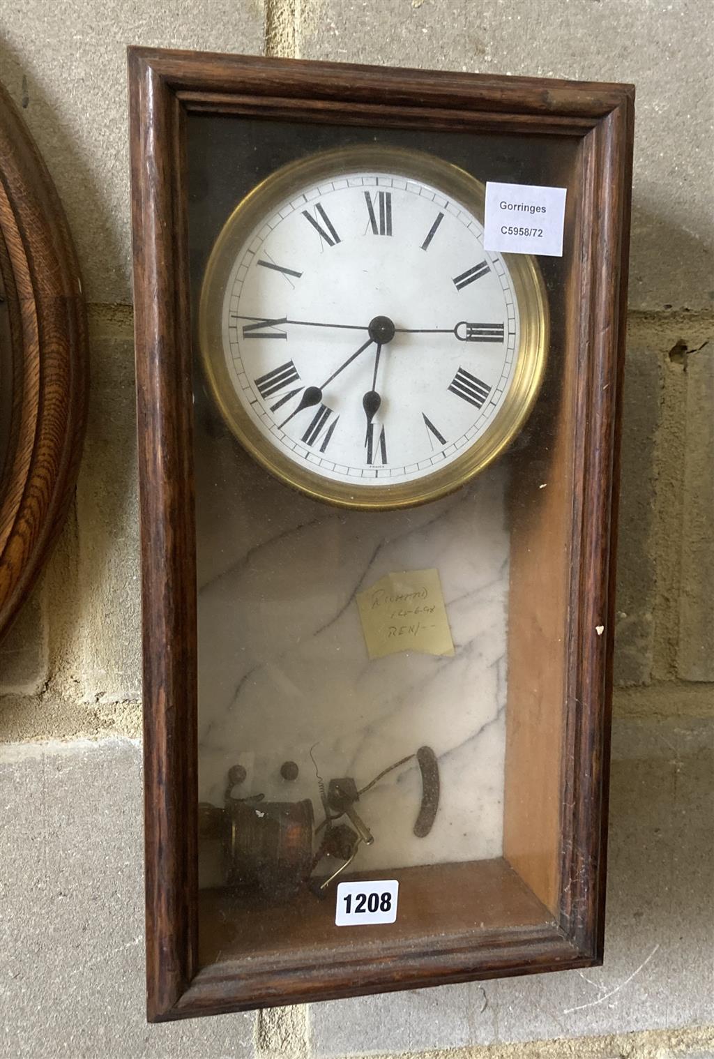 A Brillie oak and marble electric wall clock